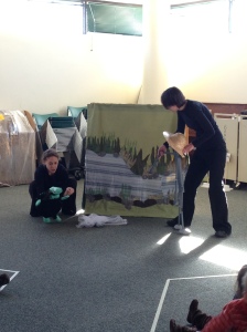 Anansi (performed by Cecilia Cackley) tries to trick Turtle into catching fish for him. 